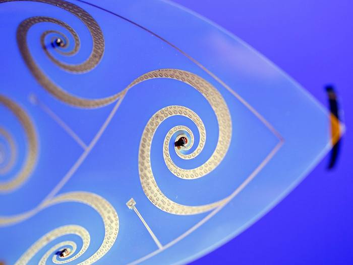 Printed spiral circuit on a glass panel in a lab