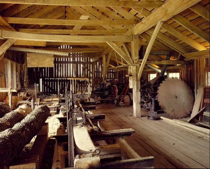 Lumber stacked inside a historic sawmill